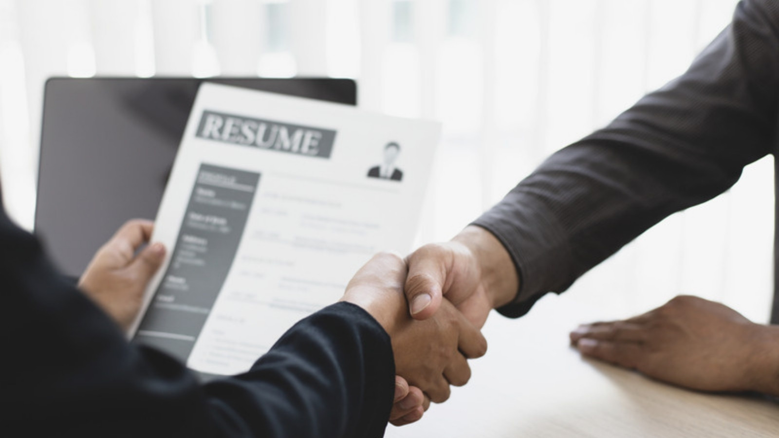 New hire handshake after job offer