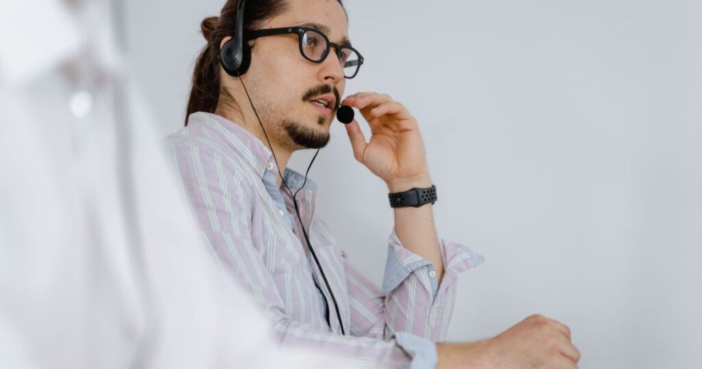Call centre agent with a headset taking a call