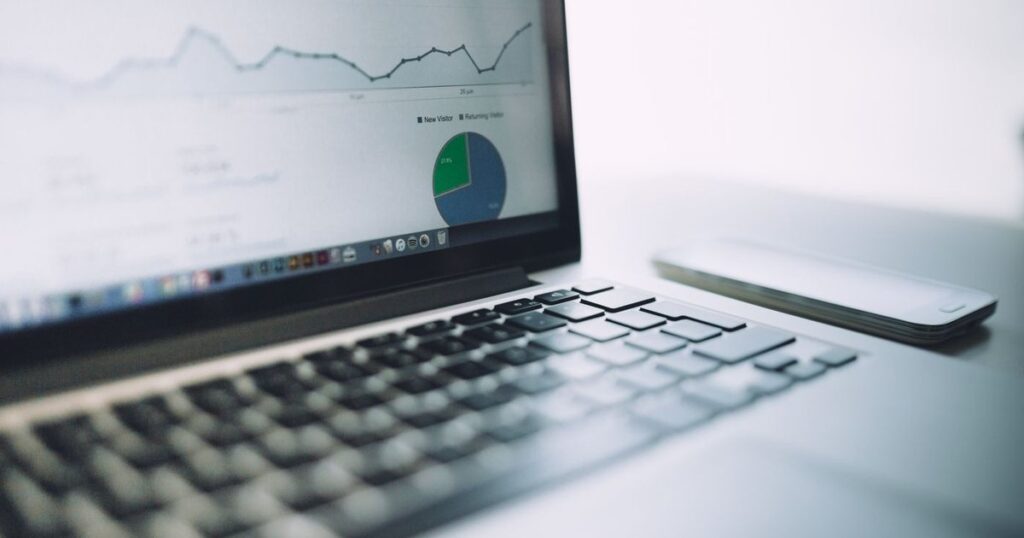 Laptop showing a marketing analytics dashboard with charts