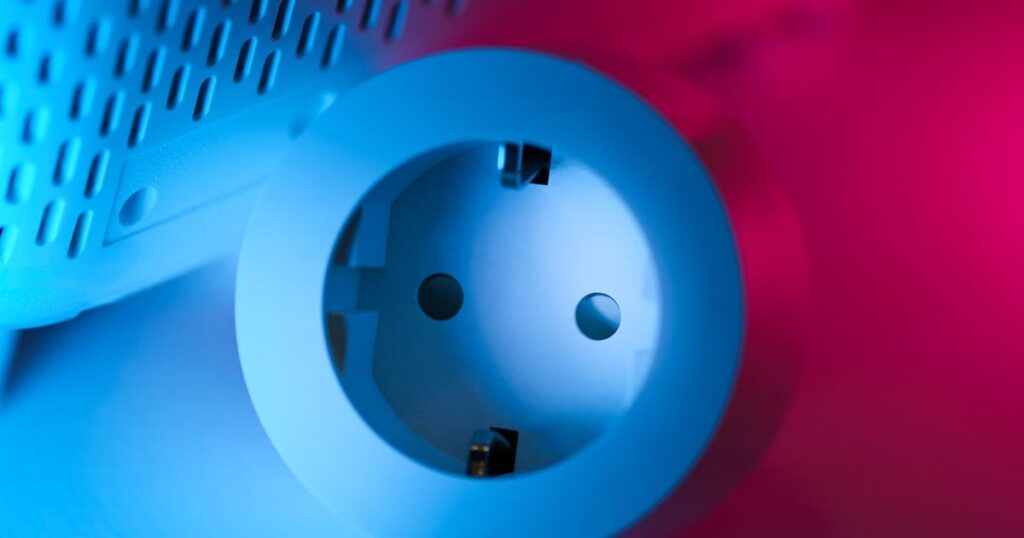Smart power socket lit with blue and pink light